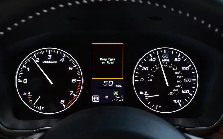 Keep Eyes on Road attention warning on the information cluster of a Subaru Legacy