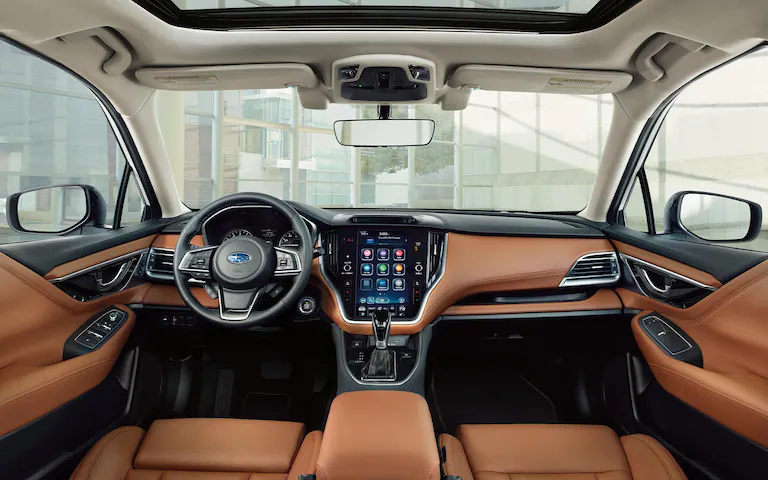 Brown leather front seats and accents inside the 2022 Subaru Legacy