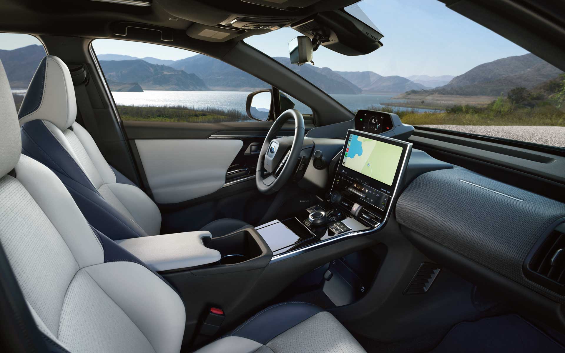 Side view of the white and blue cloth seats inside a 2023 Subaru Solterra