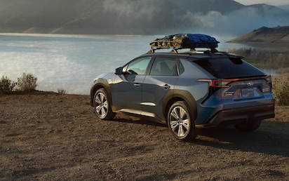 A 2023 Solterra Touring parked near a lake.