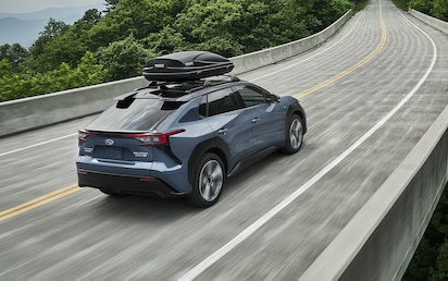 A 2023 Solterra driving on a bridge.