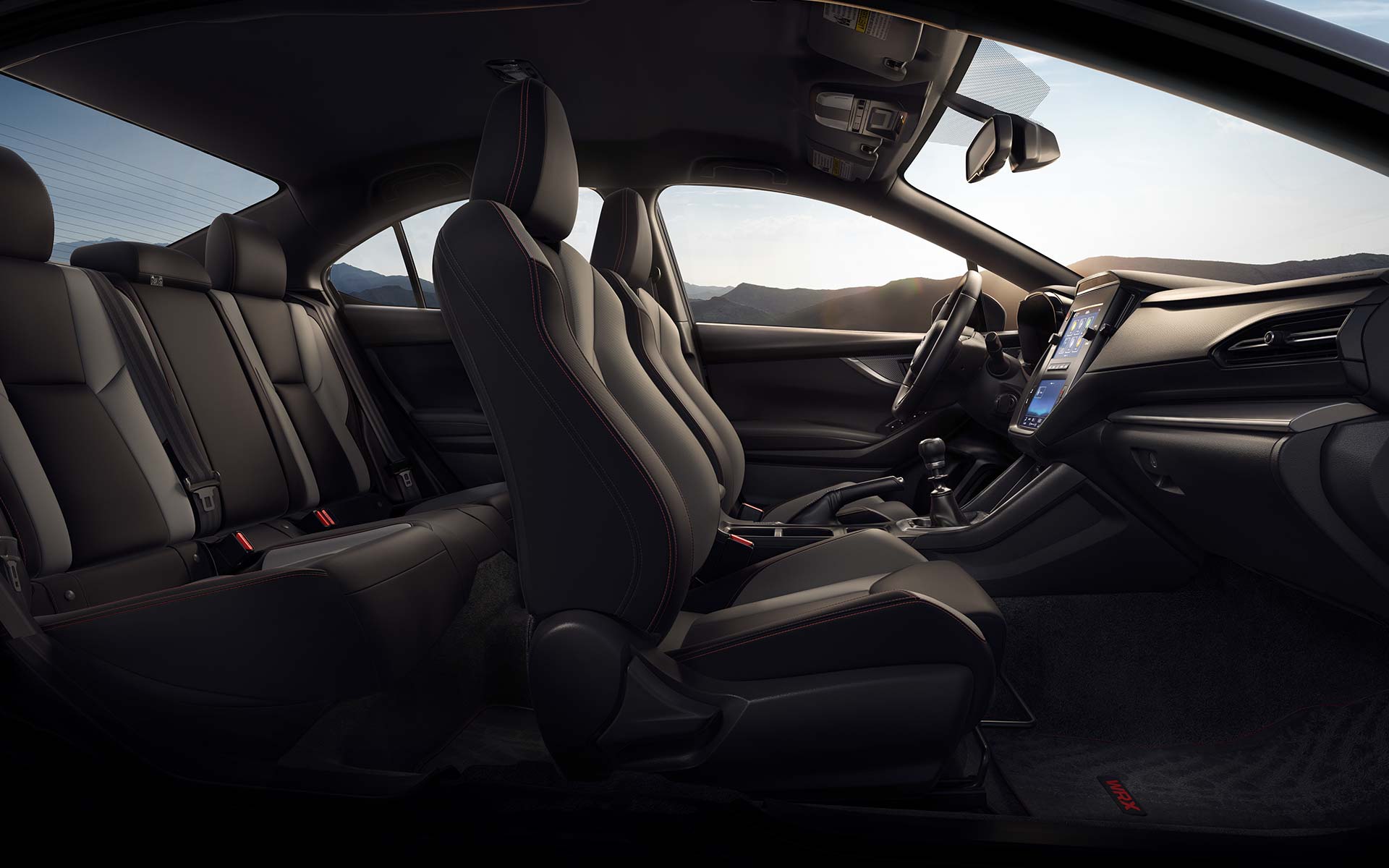 Side view of black cloth seats inside a Subaru WRX